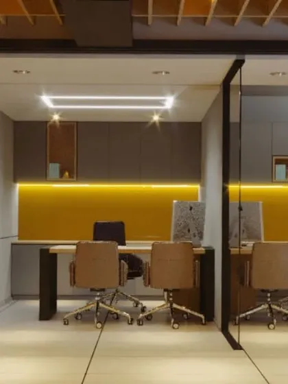 Semi-private workstations designed for focused work. We used glass partitions to maintain an open feel while providing acoustic separation, and a pop of mustard yellow adds energy to the neutral color scheme.
