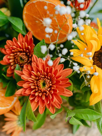 A macro shot of the stunning orange and yellow florals, showing the freshness and vibrancy of the flowers we use.