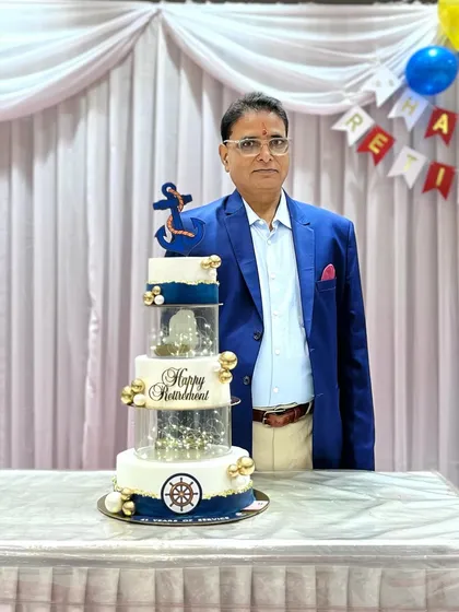 The gentleman celebrating his retirement with our custom Navy-themed cake.