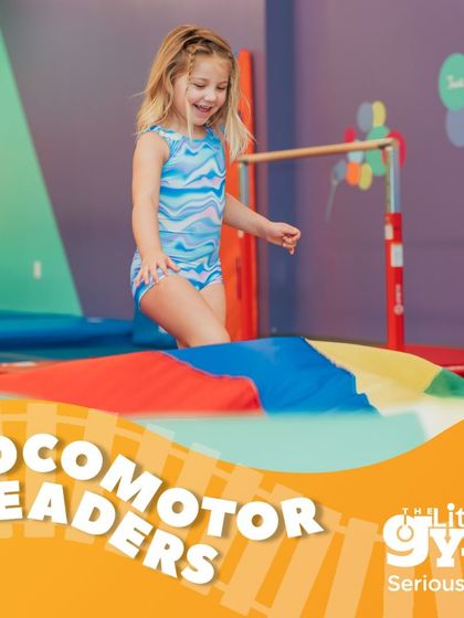 Our 'Locomotor Leaders' program for Pre-K kids focuses on mastering fundamental movements like jumping and hopping. This girl navigates a parachute, building coordination and confidence.