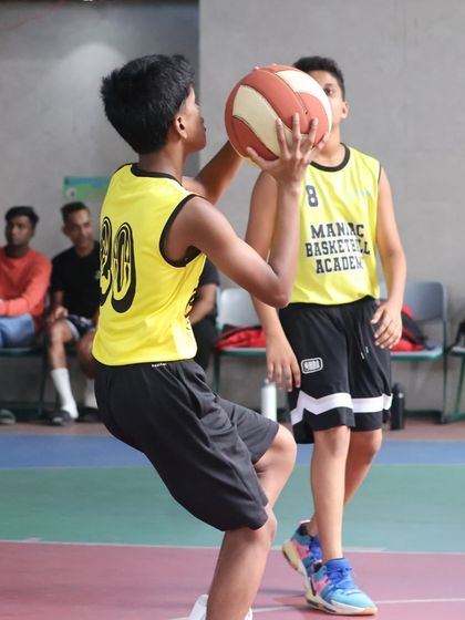A player looks to make a pass during a game. Our coaching emphasizes the importance of teamwork and finding the open man.