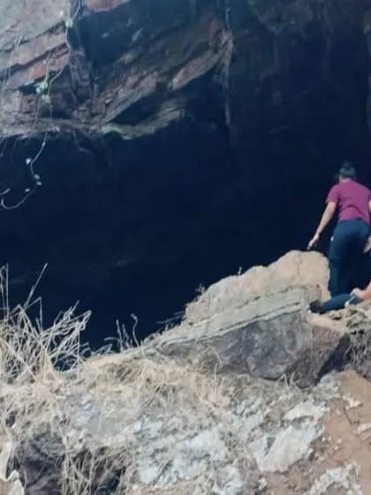 The challenging entrance to one of the caves, requiring some scrambling over rocks.