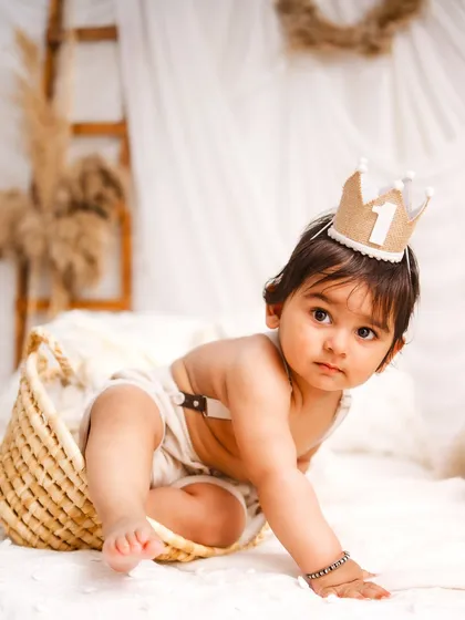 A curious crawl. This action shot captures the exploratory nature of a one-year-old, even in a calm, minimalist setting.