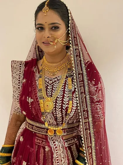 This bride is slaying in her North Indian lehenga. For her third look of the day, we went with a classic red lehenga, complete with a dupatta setting and matching jewelry.