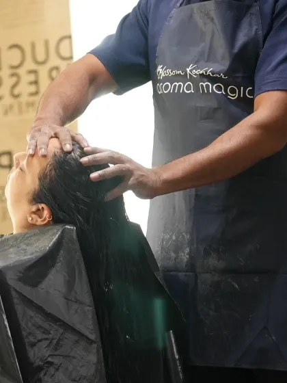 Our therapist applies gentle yet firm pressure during a head massage, a key part of our luxurious hair spa experience. This helps to relieve tension and promote a sense of calm.