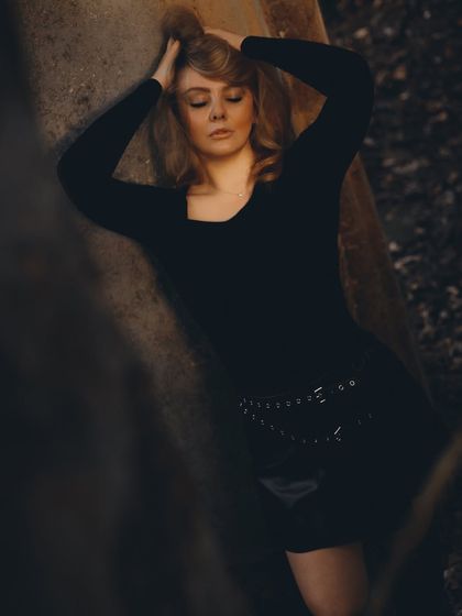 Lost in thought, dreaming about the upcoming December tour. This image captures the quiet moments of planning and anticipation before hitting the road.