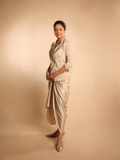 The complete look, a perfect blend of traditional draping techniques with a modern, fashion-forward aesthetic.