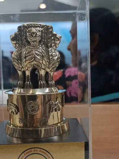 A close-up of the Honour of Ashoka Award memento. It represents the values of justice, peace, and righteous conduct that I strive to embody in my legal practice.