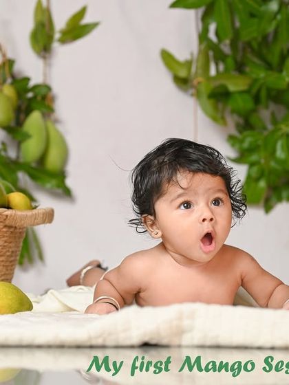 A seasonal 'Mango Session' for a 5-month-old. The baby's surprised expression is priceless! I love incorporating natural elements into my shoots.