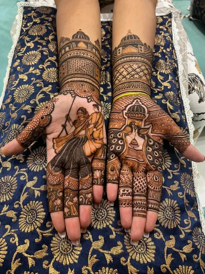 Both hands of a bride, each telling a story. One palm features a playful couple on a swing, while the other showcases traditional motifs, blending personal moments with classic bridal art.