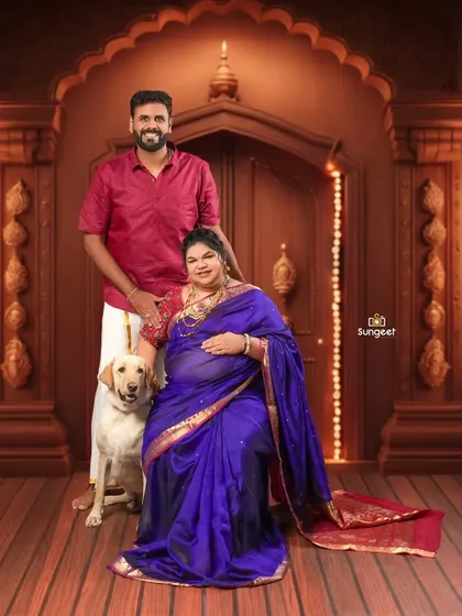 Including a beloved pet in your maternity shoot is a wonderful idea. Here, the family dog joins the expecting couple for a complete family portrait.