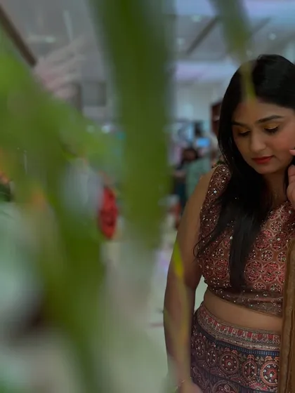 A candid, artistic shot in a beautiful ethnic outfit. I appreciate the small, quiet moments amidst the chaos of an event.
