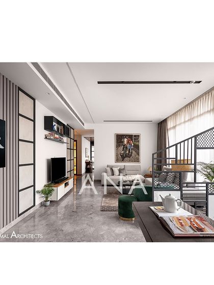 An overall shot of the living area in Apartment 704, showing how the different zones connect. The design balances minimal furniture with textured partitions and walls to create a dynamic, modern home.