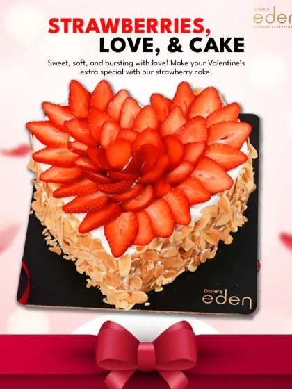 Strawberries, love, and cake. This heart-shaped cake is topped with fresh strawberries arranged like a flower and has crunchy almonds on the side, making it an extra special Valentine's treat.