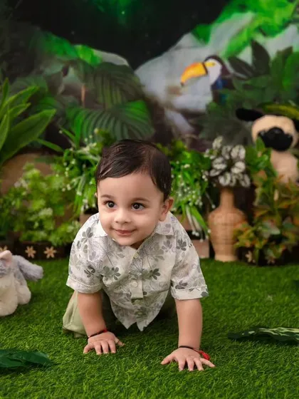 On the crawl in the jungle. This action shot captures the energy and excitement of a little one exploring the safari set.