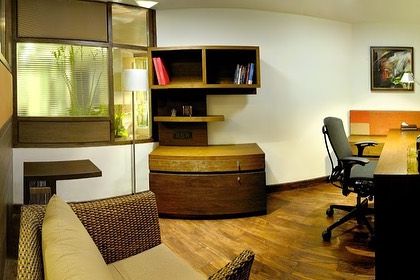 From my archives, a home office in the Egon Zehnder project. The design features warm wood tones, a custom desk, and a large window looking out onto greenery, creating a calm and productive workspace.