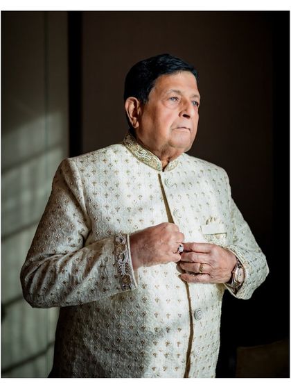 A classic portrait of the groom from the 50th-anniversary celebration, looking dapper and elegant.