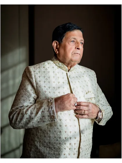 A classic portrait of the groom from the 50th-anniversary celebration, looking dapper and elegant.