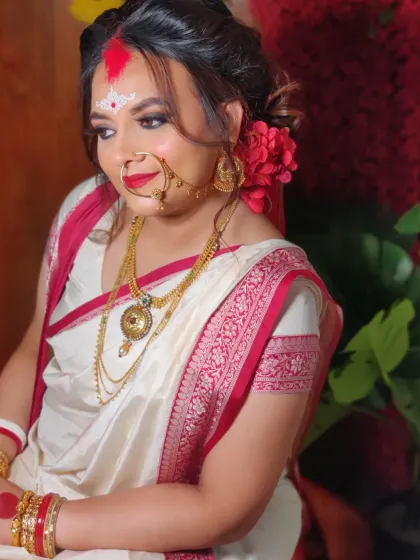 Nishita's soft glam makeup enhances her features beautifully.