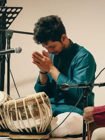 A moment of pranaam, or respectful greeting, to the stage and my instruments before starting my performance. It is a gesture of gratitude for the music.