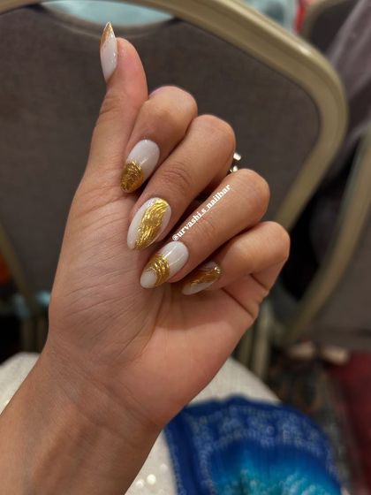 A striking design featuring a matte white base with textured gold chrome accents. The contrast between the simple white and the metallic gold creates a modern and luxurious look.