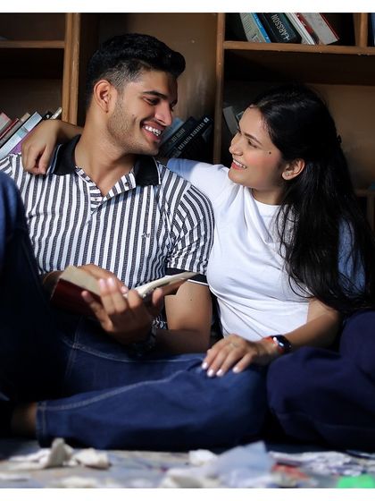 A fun and candid moment captured during a pre-wedding shoot in our library, showing the versatility of the space.