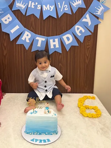 The birthday boy looking so dapper next to his half birthday cake. Thank you for sharing this with me!