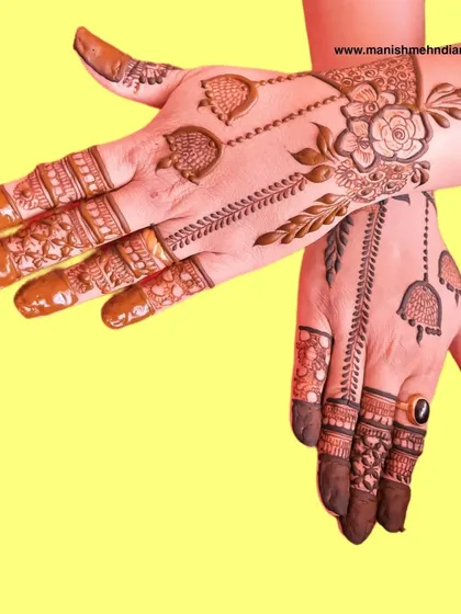 Two different designs on display. One hand features a floral and bell (jhumka) design, while the other has a more abstract pattern, showing the creative possibilities.
