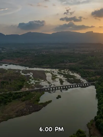 The sun begins its descent over Tahuli Peak at 6:00 PM. A beautiful, calm evening in Badlapur.
