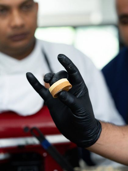 A demonstration of precise layering techniques during the Marriott Pastry Symposium.