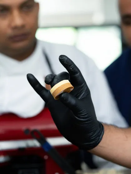 A demonstration of precise layering techniques during the Marriott Pastry Symposium.