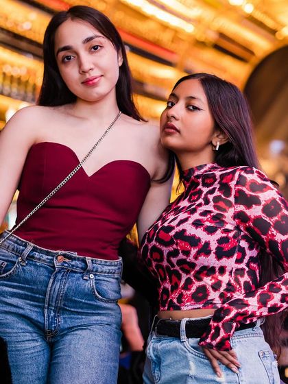 Two guests showing off their trendy outfits.