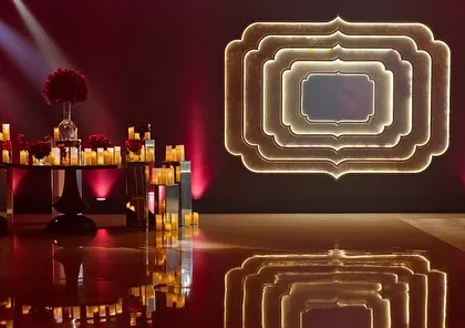 The stage design for our 'Raga Saga' night featured a reflective floor and a custom-lit backdrop, creating a polished and professional setting for the artists. Every detail is planned to enhance the live concert feel.