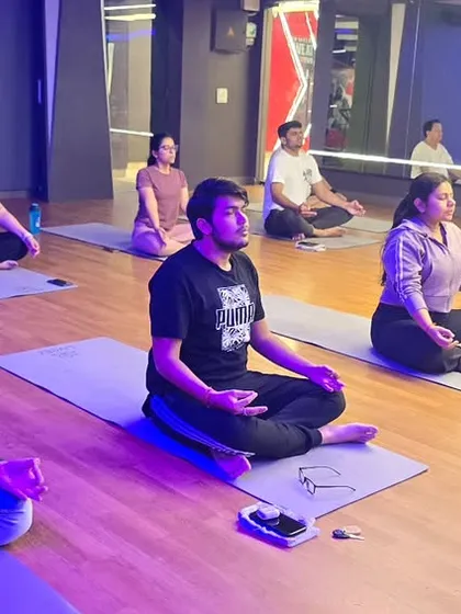 A class deep in meditation. I guide my students to connect with their inner selves, helping to enlighten their path and find peace amidst the chaos.