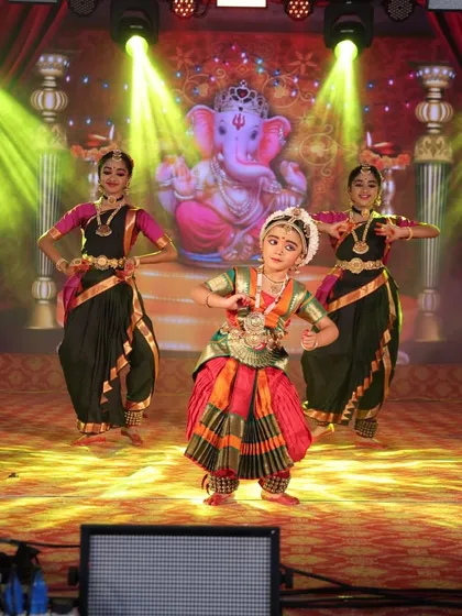 A young dancer takes center stage, confidently performing her piece. We nurture individual talent and provide every student a chance to shine.