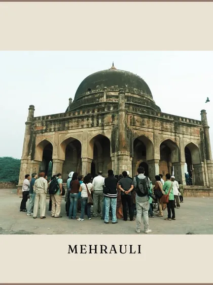 A group stands before a Lodi-era tomb in Mehrauli, another of Delhi's historic villages where monuments are scattered amidst lush greenery.