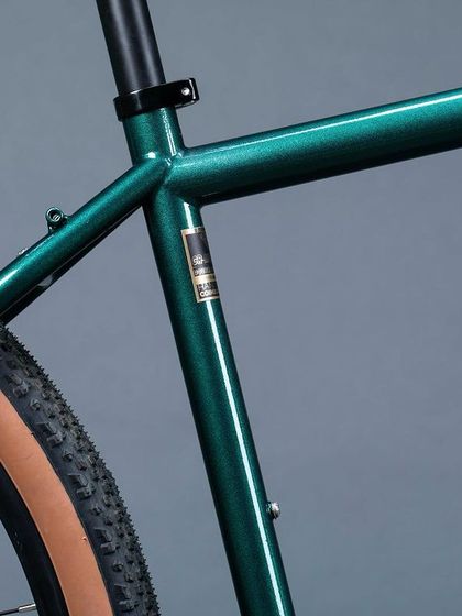 The clean lines of the Reynolds 525 steel frame. Notice the mounting points for luggage racks, a critical feature for any serious touring or bikepacking bicycle.