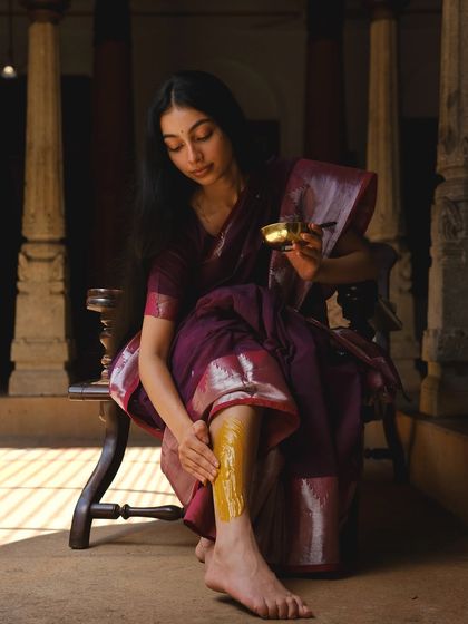 Applying a traditional turmeric paste, a shot from the 'Love Paati' wellness campaign.