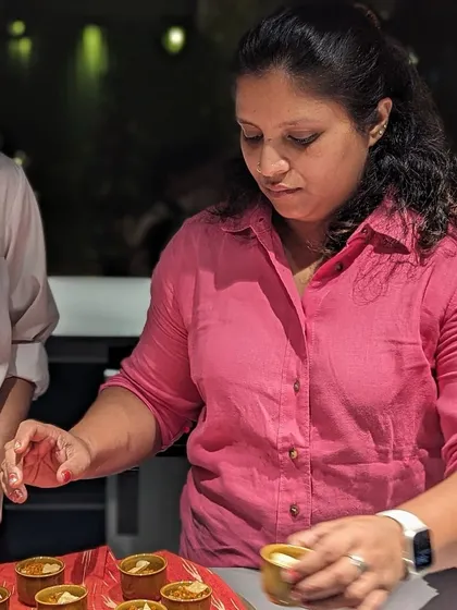 The final touch is everything. Here I am plating a dish during a busy service. My consulting process covers everything from recipe development to ensuring your team can deliver beautiful, consistent plates every time.