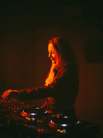 A smile while I'm mixing. I genuinely love what I do, and I think that energy translates to the dance floor.