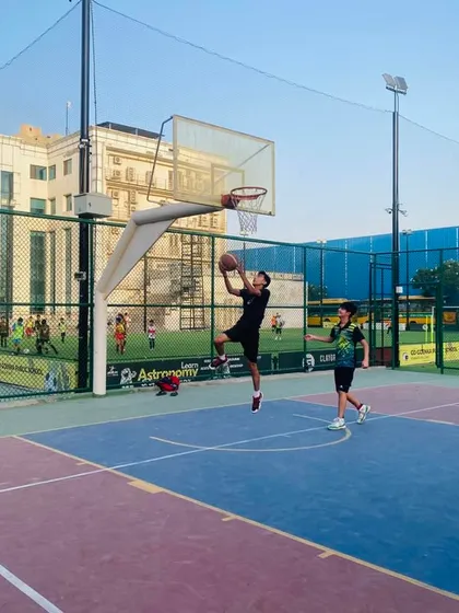 A player drives hard for a layup, demonstrating the attacking mindset we coach.