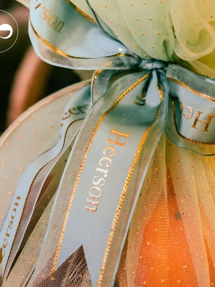 Beautifully wrapped gift hampers with personalized ribbons. I can help you curate and design thoughtful party favors that your guests will love.
