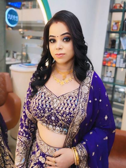 A beautiful portrait of my client, showcasing her complete party makeup. The look features defined eyes, a neutral lip, and soft curls.