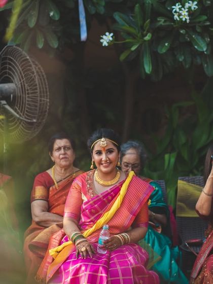 A bride sits amongst the guests, a water bottle in hand, taking a quiet moment for herself. We document the real, unglamorous moments too, because they are part of the story.