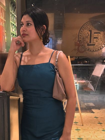 A candid moment in my teal dress. The simple spaghetti straps and clean neckline make it a modern classic.