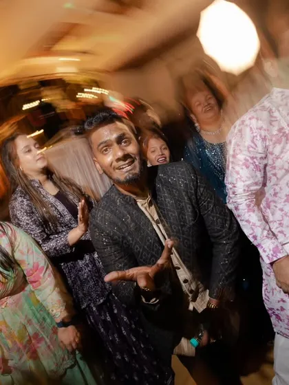 A great candid shot of a guest enjoying the music and the party atmosphere.