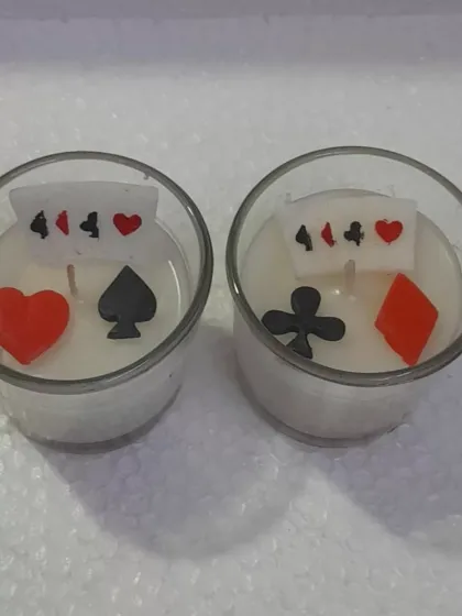 Light up your game night with a little poker magic. These card-inspired tealight candles feature wax suits of cards and are perfect for a lucky glow.