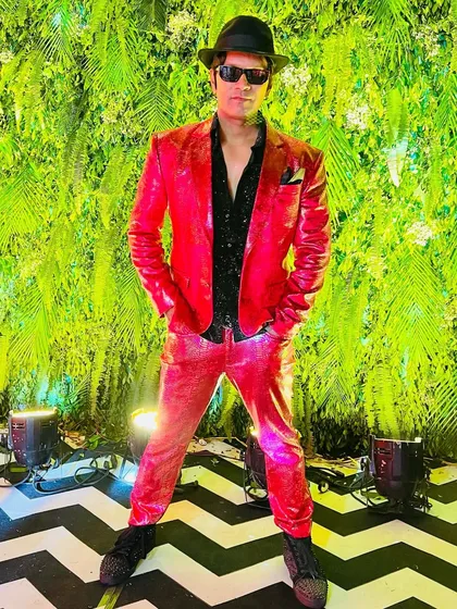 This was the closest I could get to a Santa look for a Christmas-themed sangeet in Vadodara. Rocking a red hot suit to bring the festive cheer.
