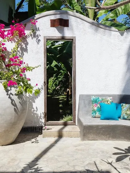 A built-in seating area in the main villa's courtyard, offering a colorful and inviting spot to relax.