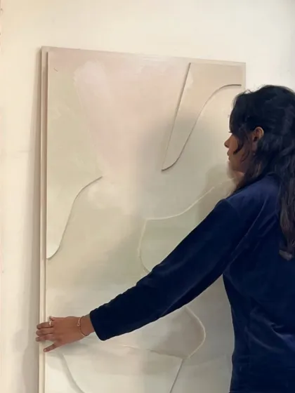 Here I am with the large vertical textured panel for my Hyderabad client. This shows the scale of the piece and how it can fill a narrow wall space beautifully.